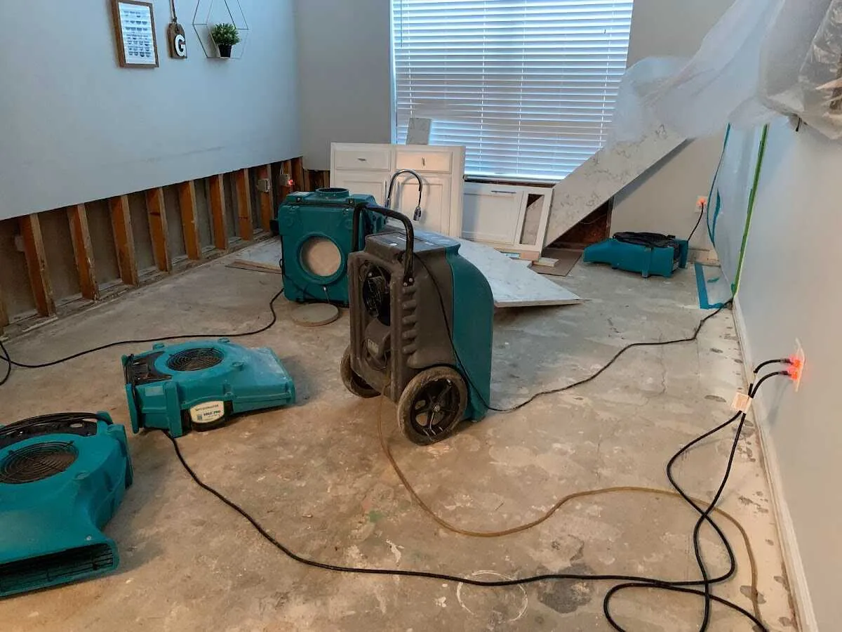 Dehumidifier in flood-cut room for Water Damage Restoration in Home Gardens